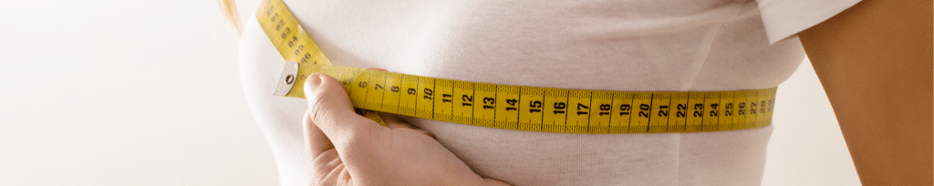 lady measuring the size of her breasts